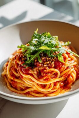 Tomaten Pasta Bowl mit Rucola und Pinienkernen - Lecker genießen!